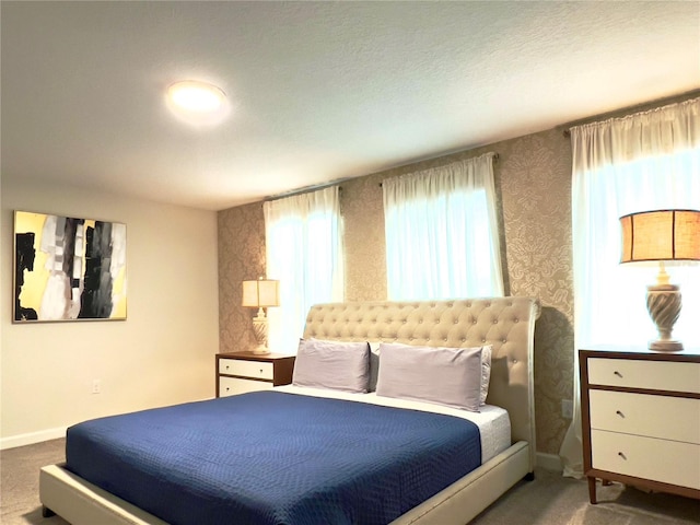 791 Pebble Beach Dr, Davenport, FL 33896 - bedroom with wallpapered walls, baseboards, carpet flooring, and multiple windows