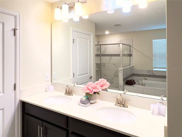 791 Pebble Beach Dr, Davenport, FL 33896 - bathroom featuring a bath, a sink, double vanity, and a stall shower