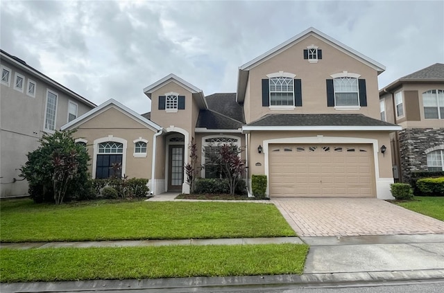 front facade with a garage and a front yard