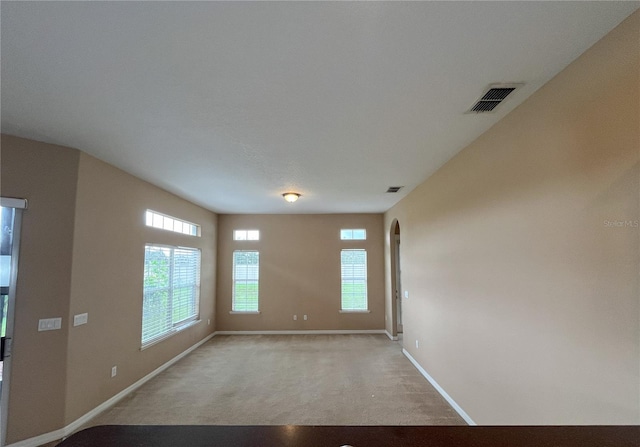 empty room featuring light carpet