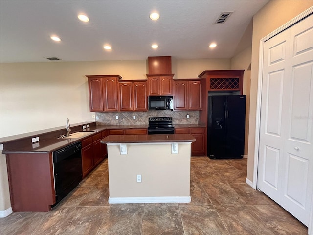 kitchen with backsplash, black appliances, sink, kitchen peninsula, and a breakfast bar area