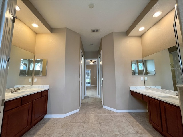 bathroom with tile patterned floors, vanity, a wealth of natural light, and ceiling fan