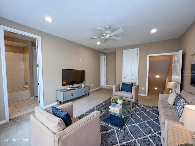 living room with carpet flooring and ceiling fan