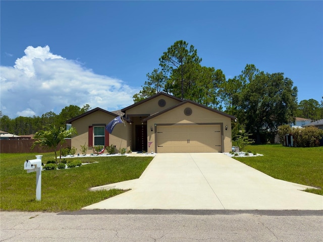 view of front of property with a garage and a front lawn