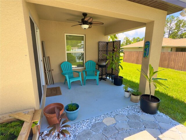 view of patio / terrace featuring ceiling fan