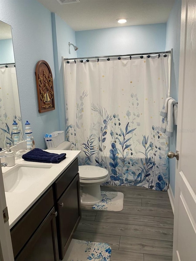 8 Slipper Flower Path E, Palm Coast, FL 32164 - full bath featuring wood finished floors, vanity, toilet, and curtained shower