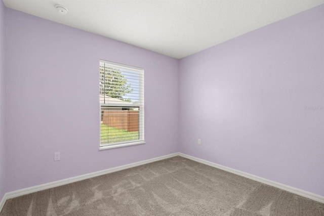8 Slipper Flower Path E, Palm Coast, FL 32164 - carpeted spare room with baseboards and a smoke detector