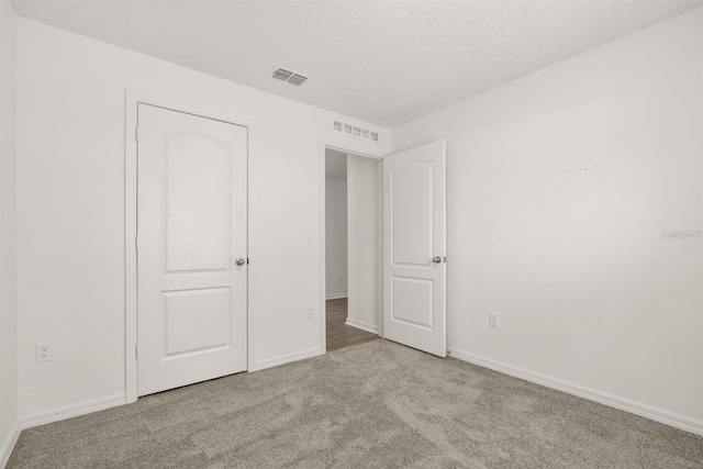 8 Slipper Flower Path E, Palm Coast, FL 32164 - unfurnished bedroom featuring carpet floors and baseboards