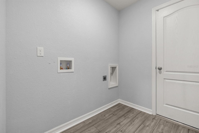 8 Slipper Flower Path E, Palm Coast, FL 32164 - laundry room featuring electric dryer hookup, wood finished floors, hookup for a washing machine, and baseboards