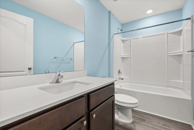 8 Slipper Flower Path E, Palm Coast, FL 32164 - bathroom featuring wood finished floors, toilet, shower / bathtub combination, and vanity