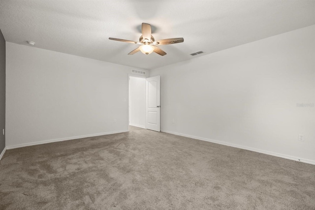 8 Slipper Flower Path E, Palm Coast, FL 32164 - empty room with ceiling fan, carpet flooring, baseboards, and a smoke detector
