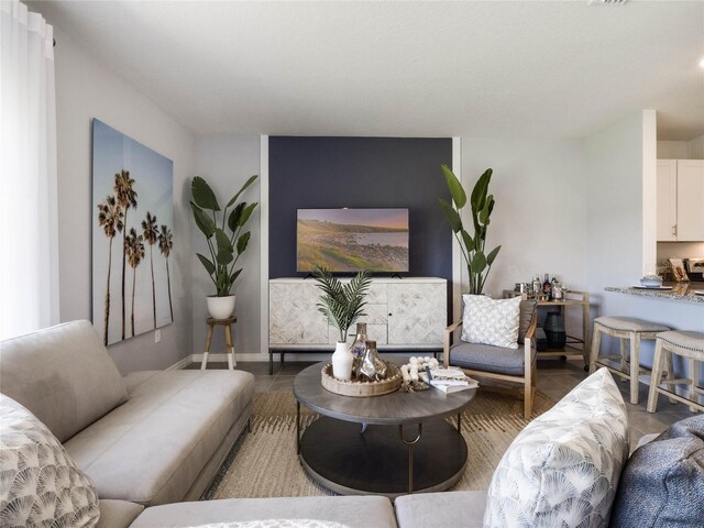 living room with tile patterned flooring