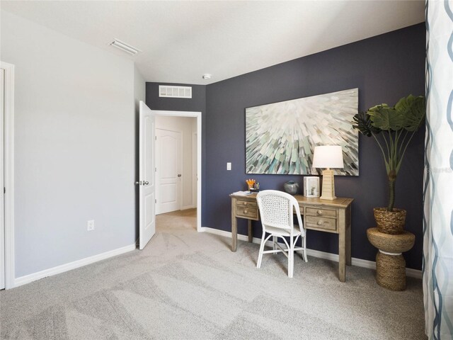 office area featuring light colored carpet