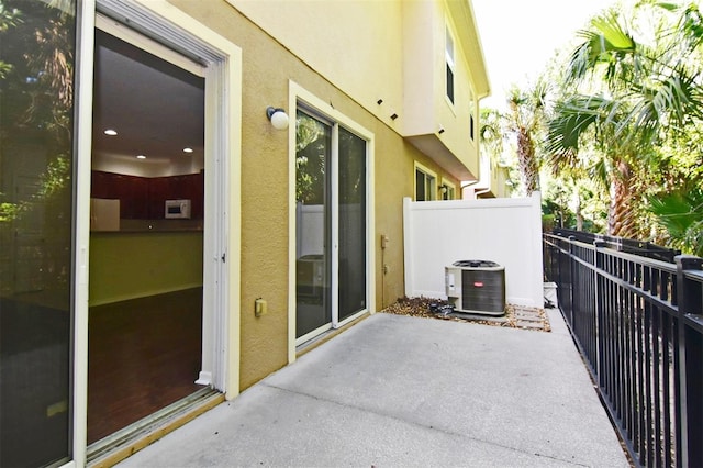 balcony featuring cooling unit and a patio area