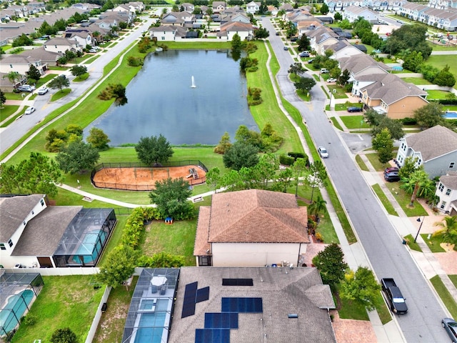 bird's eye view featuring a water view and a residential view