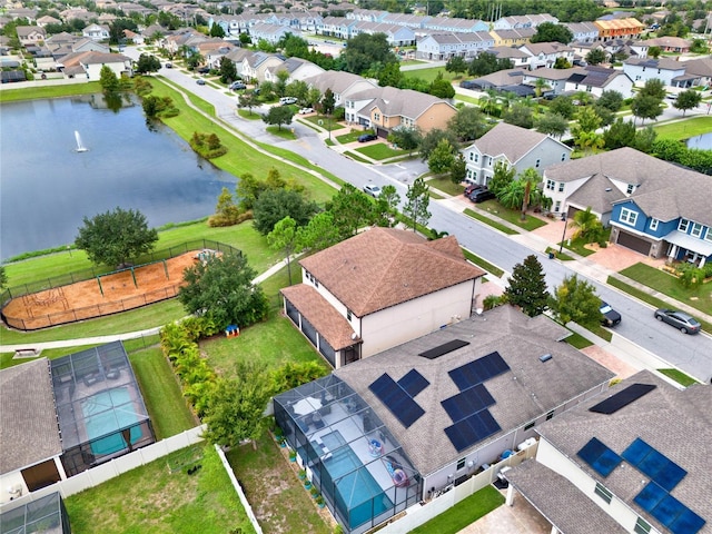 bird's eye view featuring a water view and a residential view