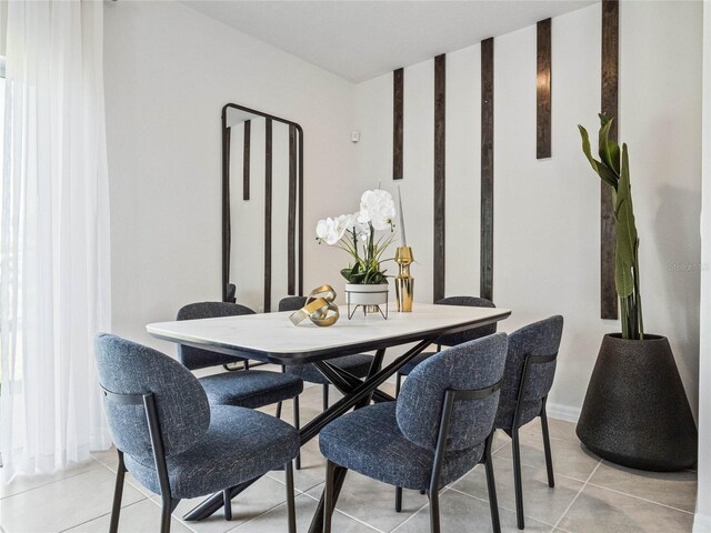 dining room featuring light tile patterned floors