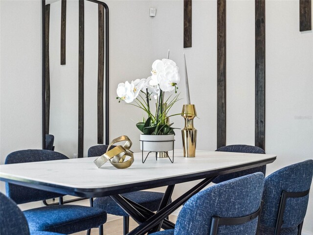 dining area with hardwood / wood-style flooring