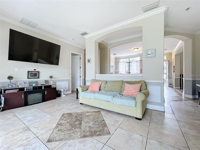 tiled living room featuring ornamental molding