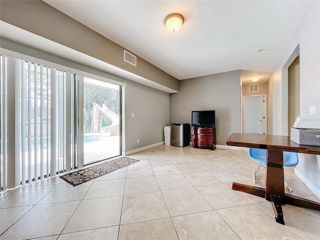 interior space with a textured ceiling