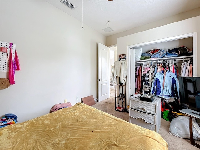 carpeted bedroom featuring a closet