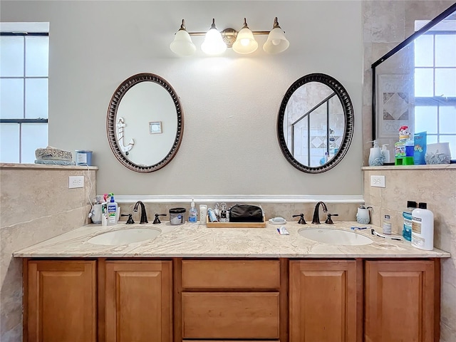 bathroom featuring vanity and an enclosed shower