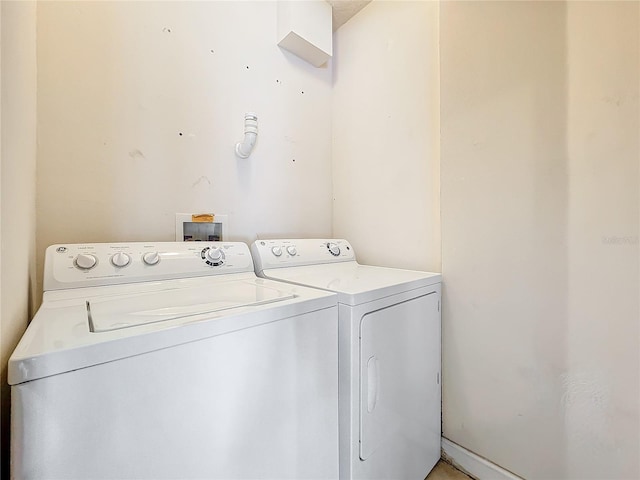 laundry room with washing machine and clothes dryer