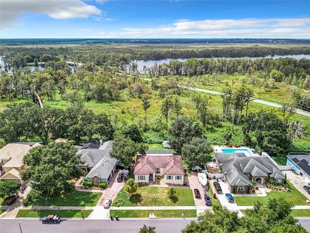 birds eye view of property with a water view