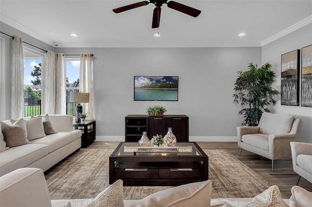 living room featuring ornamental molding, recessed lighting, wood finished floors, and baseboards