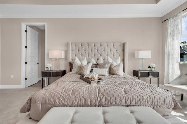 carpeted bedroom with baseboards and ornamental molding