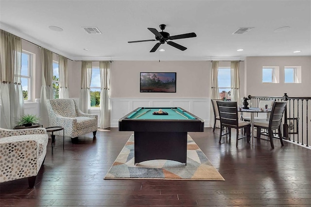 rec room featuring a wainscoted wall, dark wood-style flooring, and visible vents