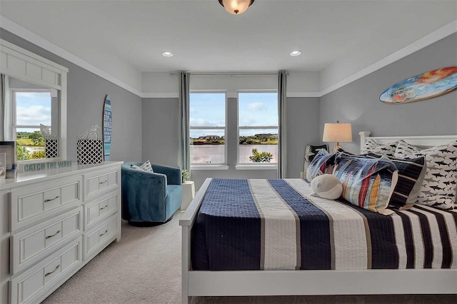 bedroom with recessed lighting and light colored carpet