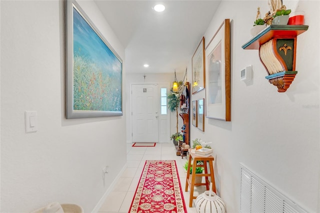 corridor featuring light tile patterned floors