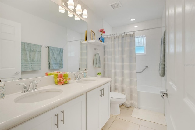 full bathroom with toilet, vanity, tile patterned floors, and shower / bath combo with shower curtain