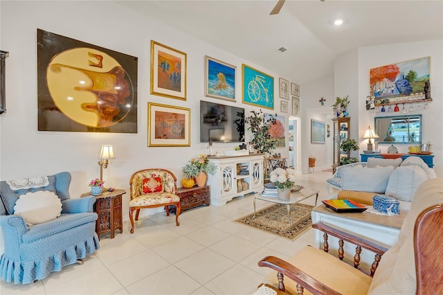 living room featuring ceiling fan, tile patterned flooring, and lofted ceiling