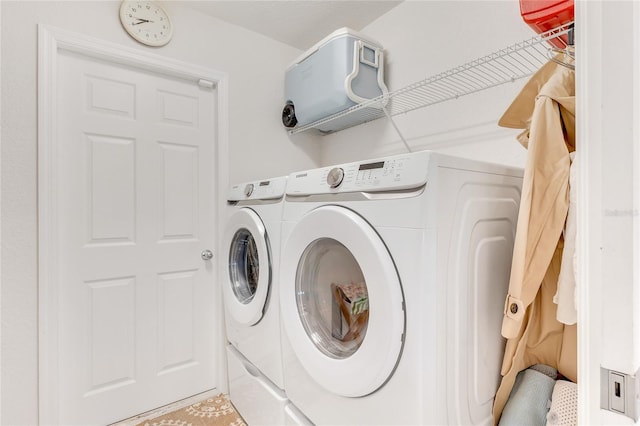 laundry room featuring washer and clothes dryer