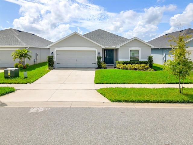 single story home featuring a garage and a front yard