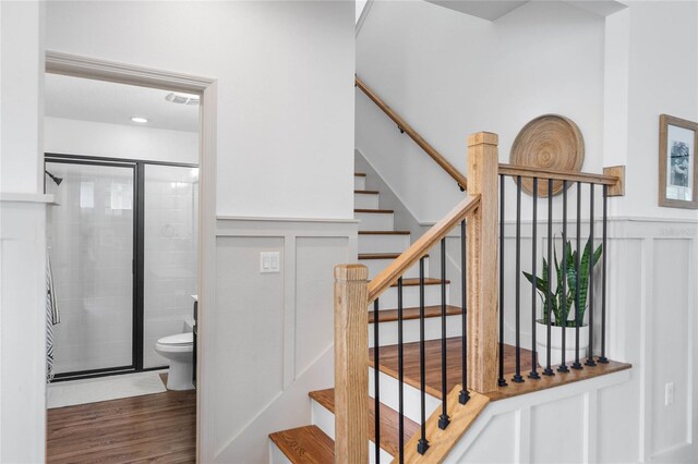 stairway with wood-type flooring