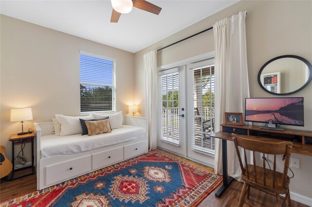 bedroom with ceiling fan, hardwood / wood-style floors, and access to exterior