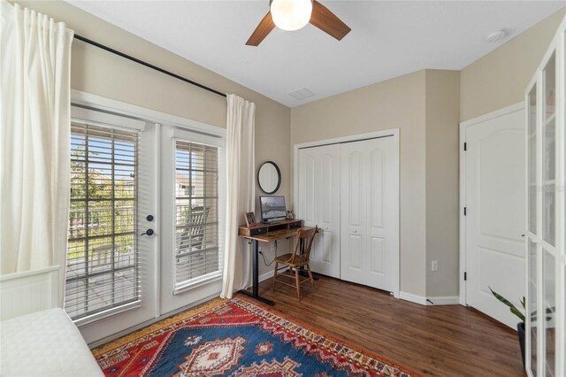 interior space with ceiling fan, dark wood-type flooring, and french doors