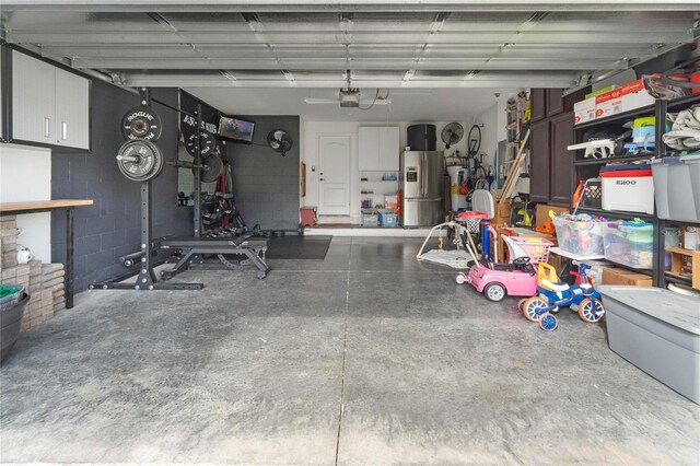 garage featuring stainless steel fridge