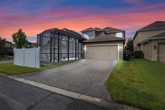 view of front of house with a lawn and a garage