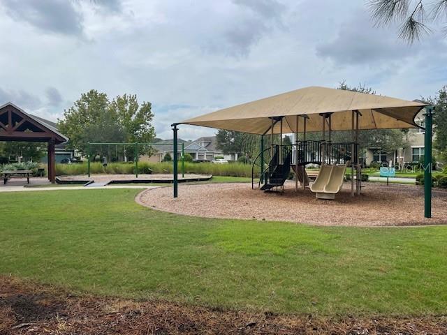 view of jungle gym with a yard