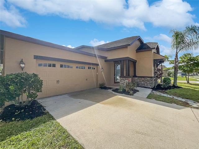 view of front facade featuring a front yard and a garage