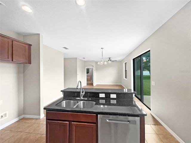 kitchen featuring hanging light fixtures, light tile patterned floors, a notable chandelier, sink, and stainless steel dishwasher