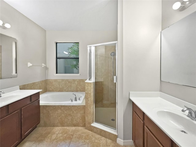 bathroom featuring vanity, independent shower and bath, and tile patterned flooring