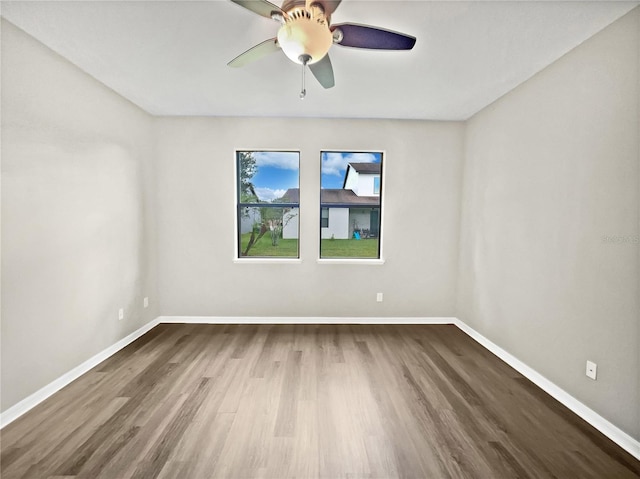 spare room with ceiling fan and hardwood / wood-style floors