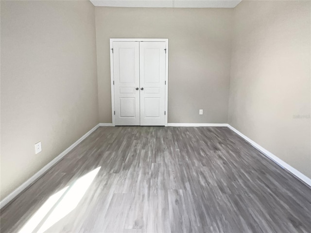 spare room featuring hardwood / wood-style floors