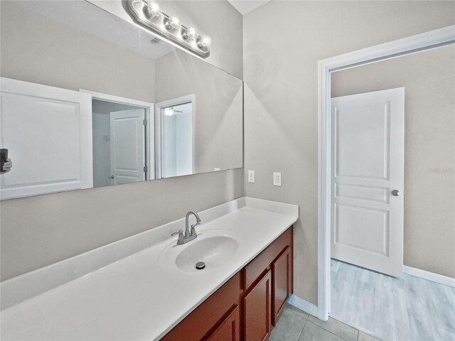 bathroom with vanity and hardwood / wood-style flooring