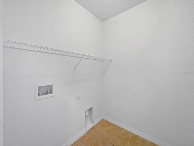 laundry room with hookup for a washing machine, hookup for an electric dryer, and tile patterned floors